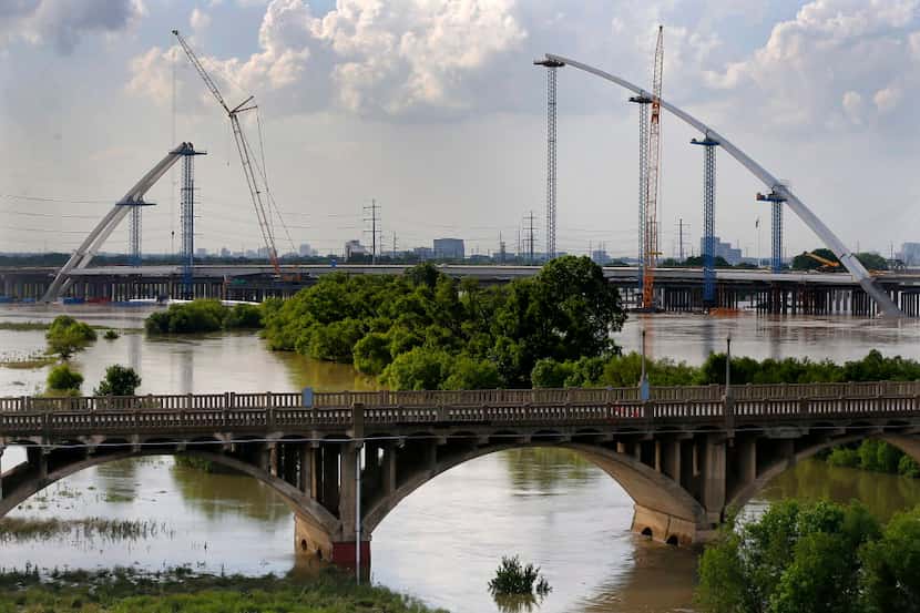  Construction of the Margaret McDermott Bridge is seen from the Jefferson St. Viaduct as the...