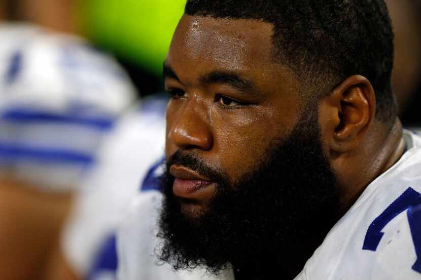 Dallas Cowboys offensive tackle Chaz Green sits on the sidelines during the second half of...