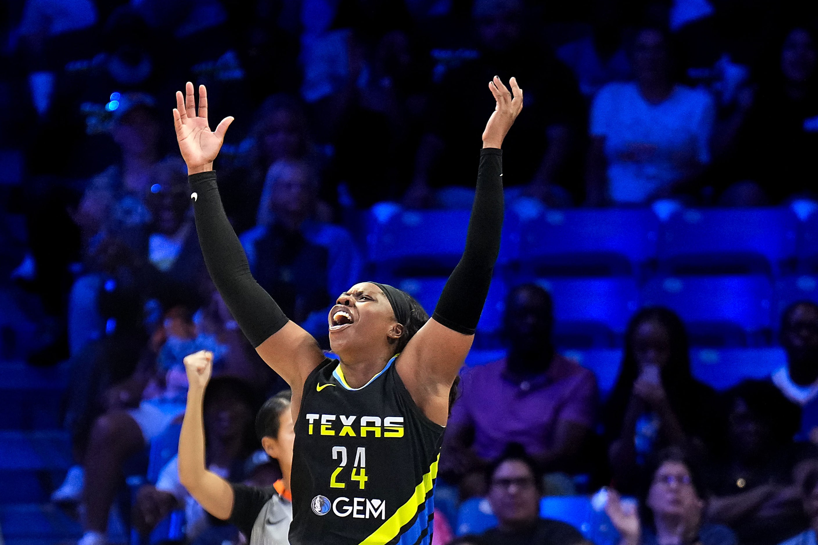 Dallas Wings guard Arike Ogunbowale (24) celebrates after being fouled on a drive to the...