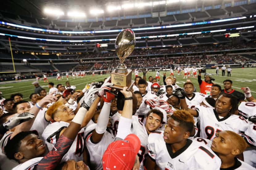 Cedar Hill players celebrate their state title at AT&T Stadium (Staff Photo)
