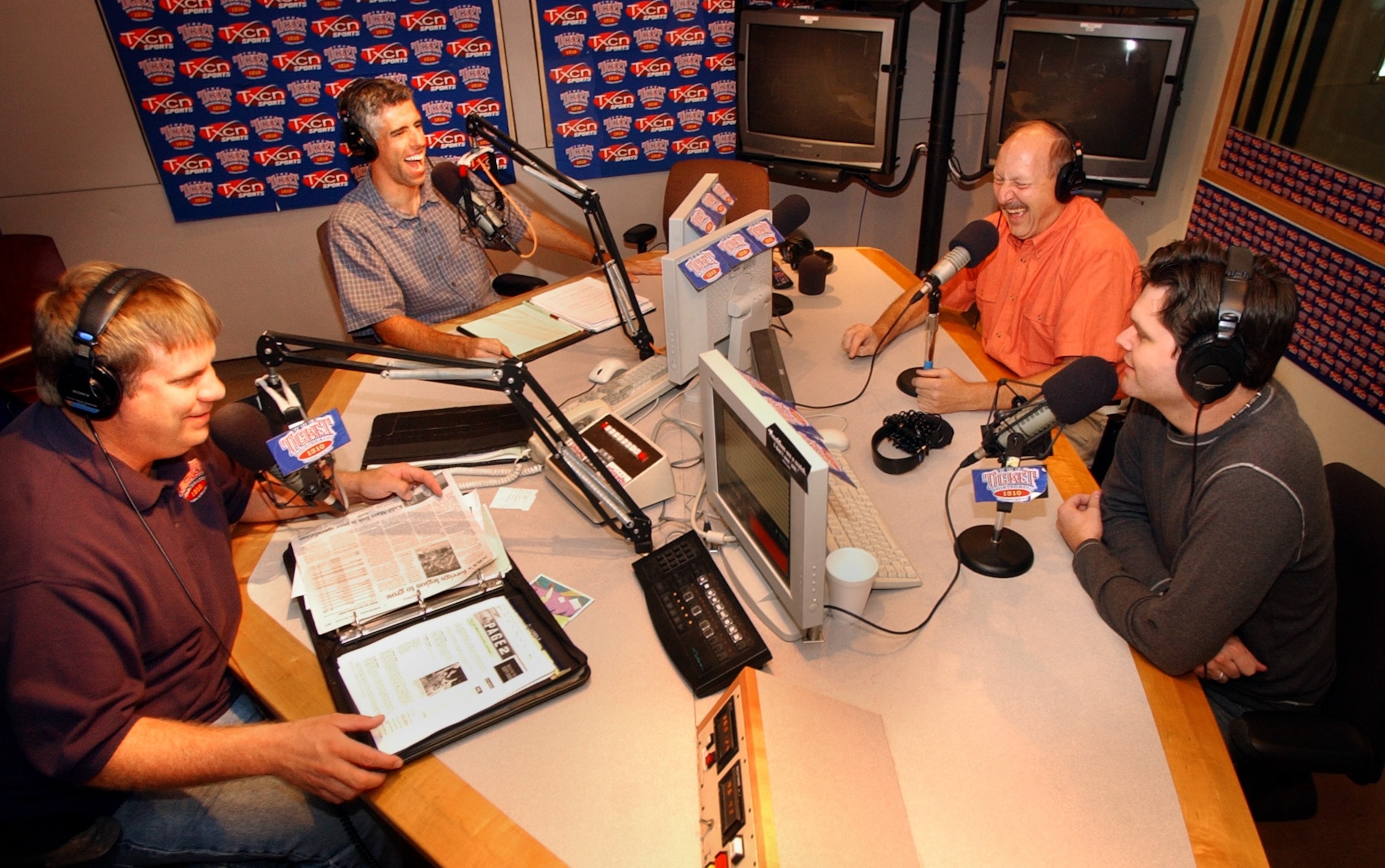 Tuesday, June 24, 2003--- KTCK-AM sports radio talks show hosts (from left to right) George...