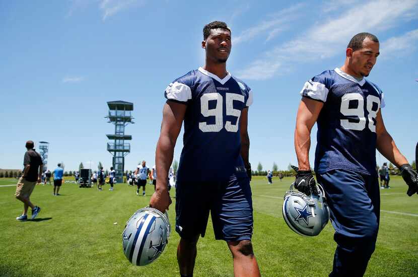 Dallas Cowboys defensive tackle David Irving (95) and defensive end Tyrone Crawford (98)...