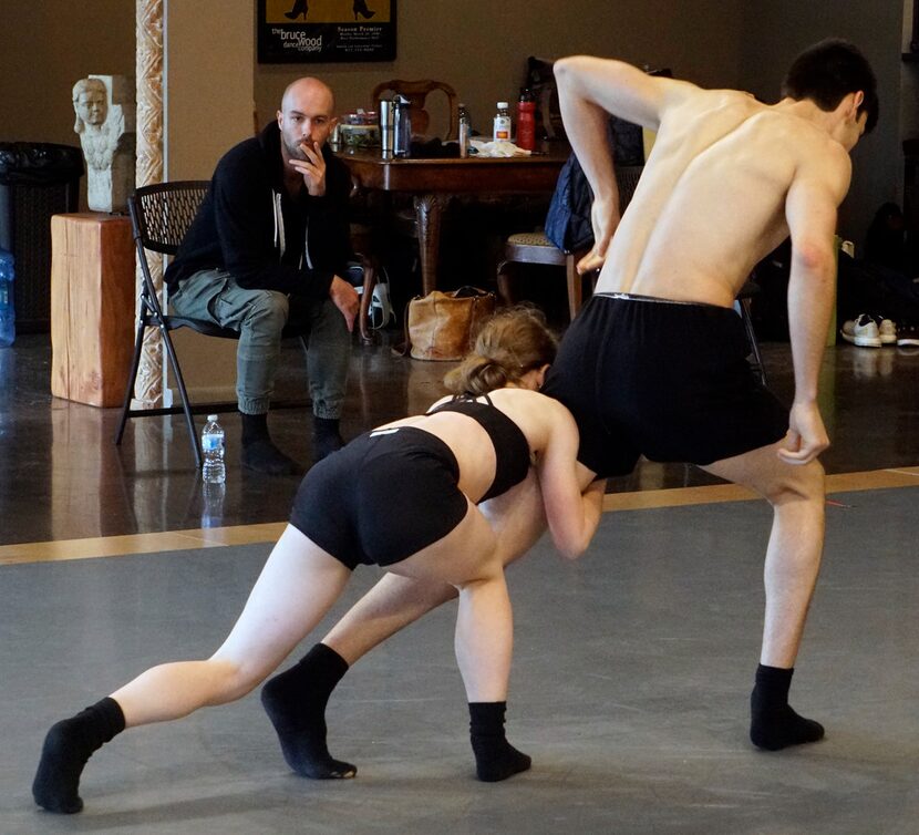 Garrett Smith watches as Bruce Wood Dance company members Lauren Hibbard and Seth York...