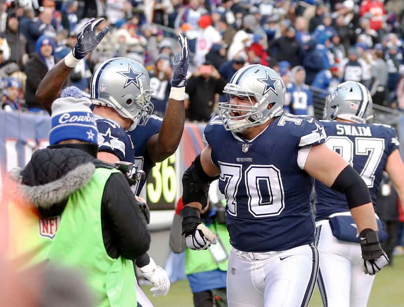 Dallas Cowboys offensive guard Zack Martin (70) and teammates celebrate a touchdown from...