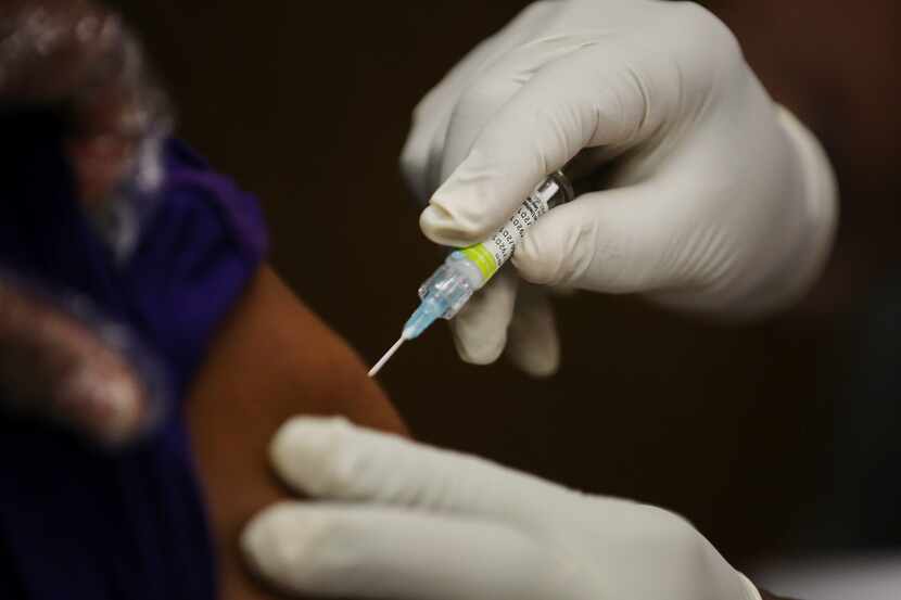 A flu shot is administered in this file photo.