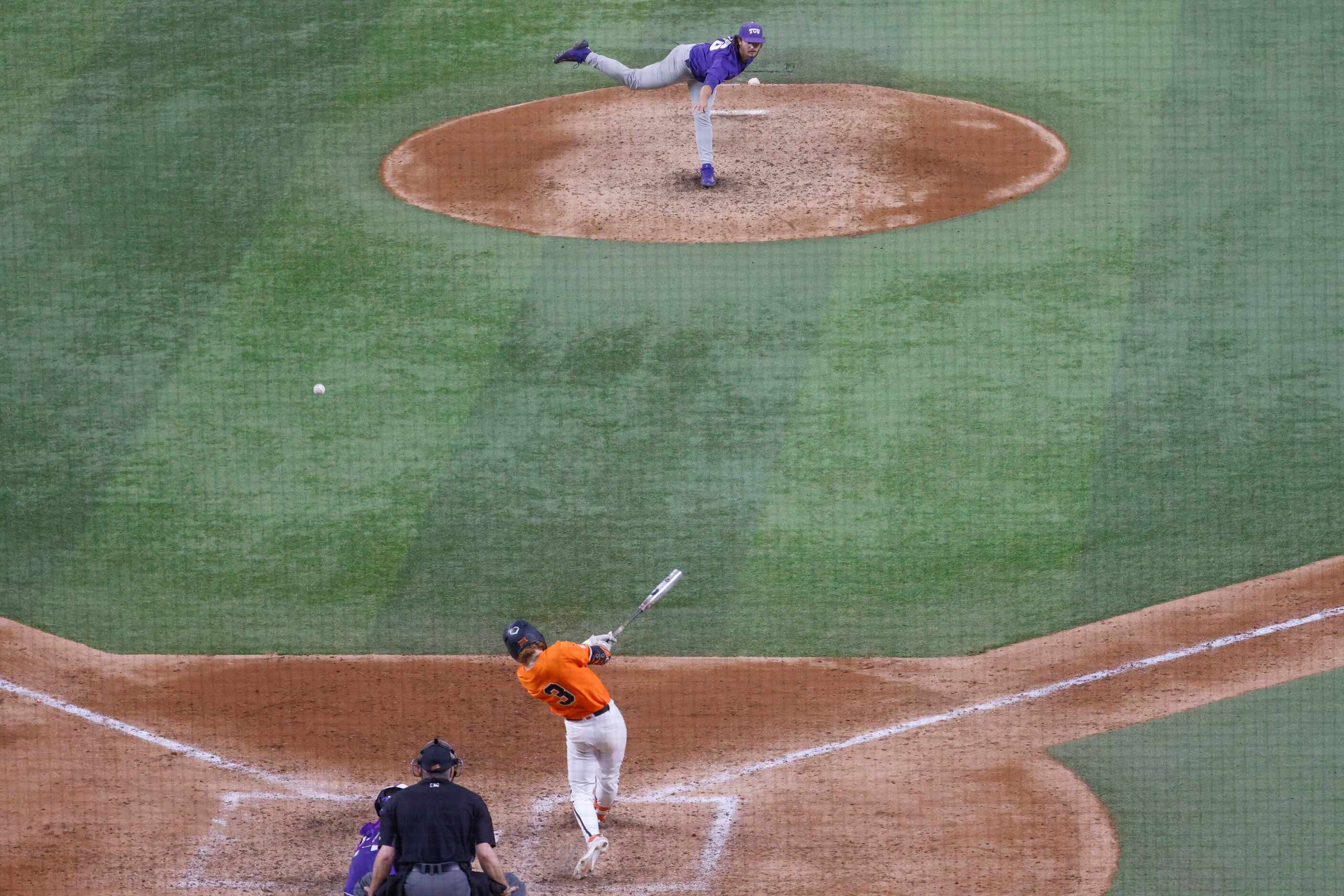 Oklahoma St. utility Carson Benge hits as TCU pitcher Luke Savage throws a pitch during the...
