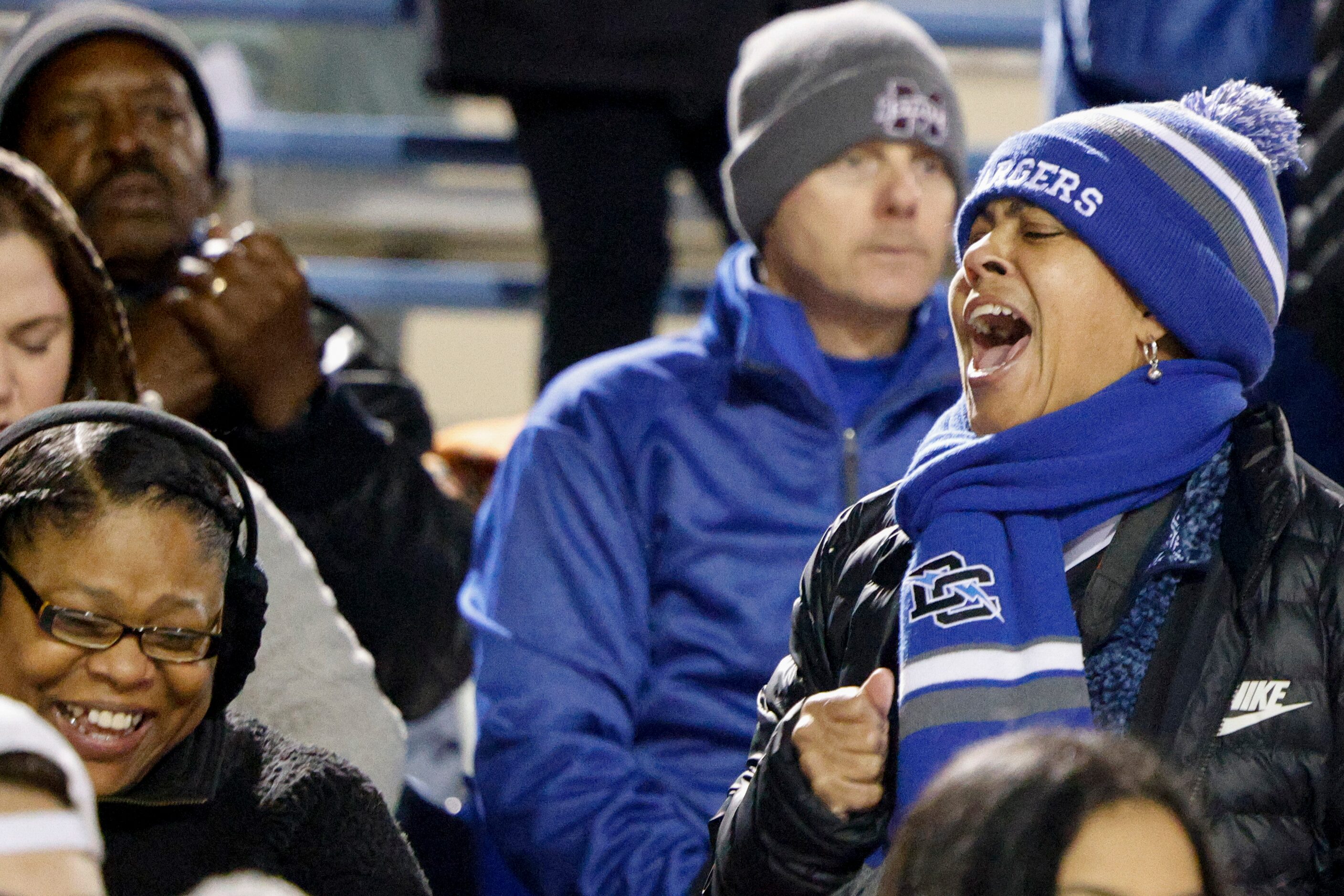 Dallas Christian fans cheer during the final seconds of the TAPPS Division III state...