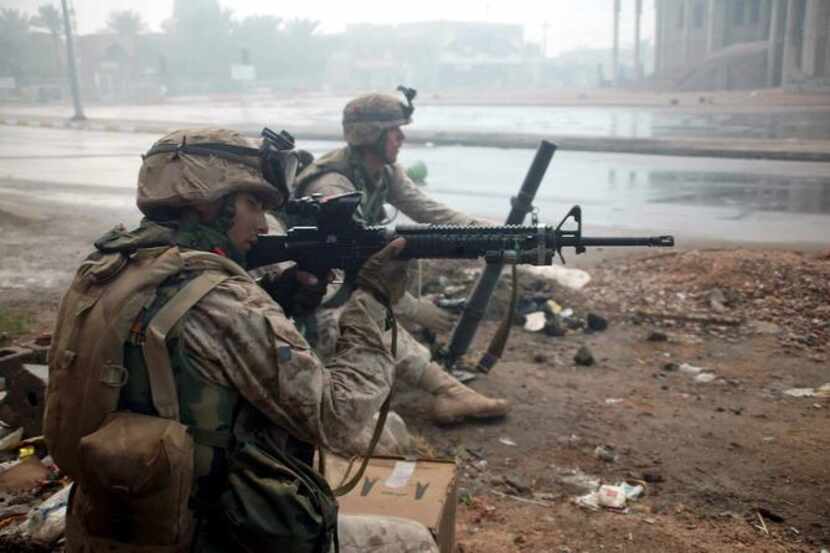 
U.S. Marines of the 1st Battalion, 8th Marines battle insurgents in the streets of...