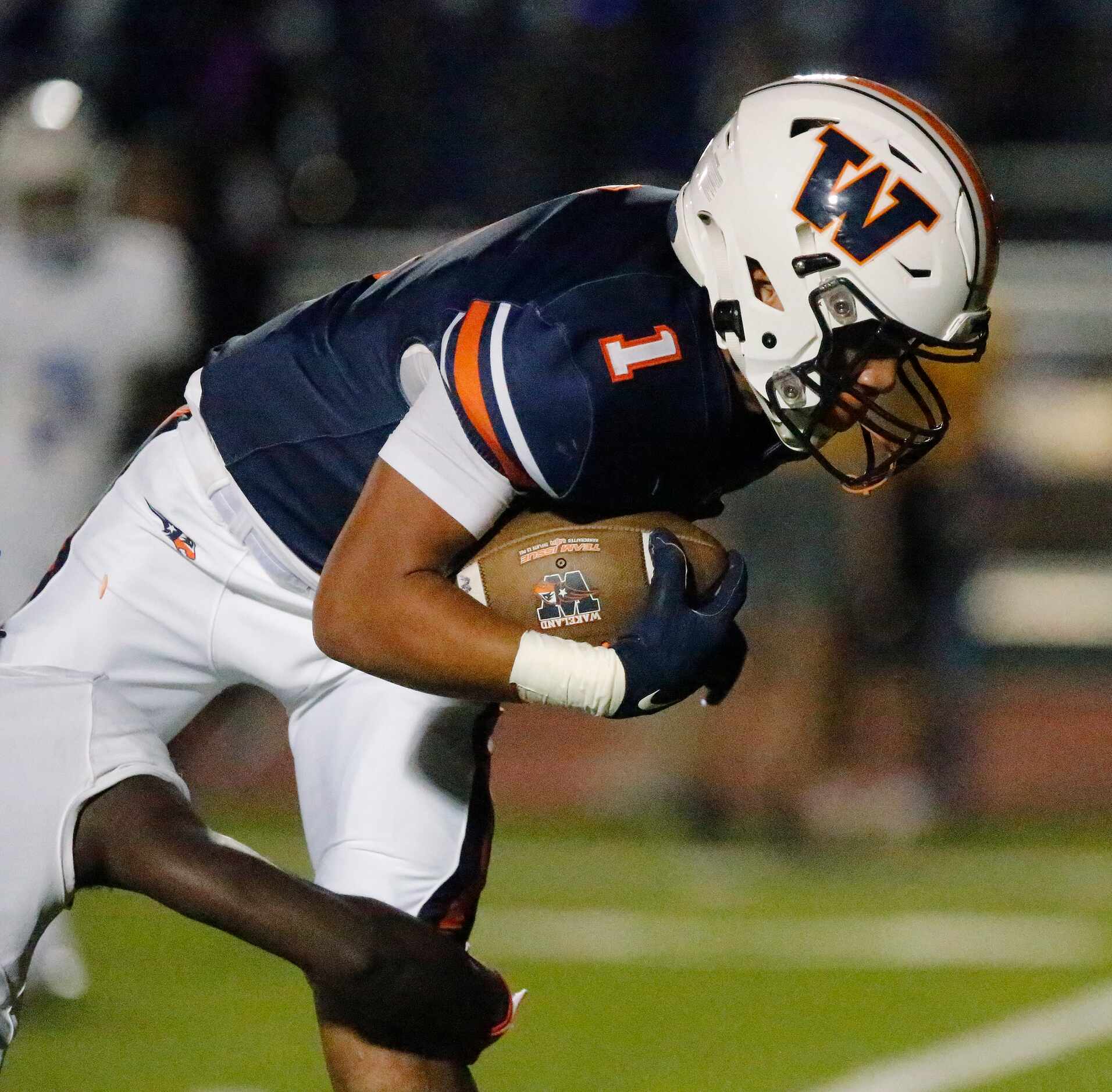 Wakeland High School wide receiver Donovan Woolen (1) is tackled after a catch during the...