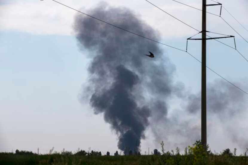 
Smoke rose from a Ukrainian army helicopter that was shot down Thursday outside Slovyansk....