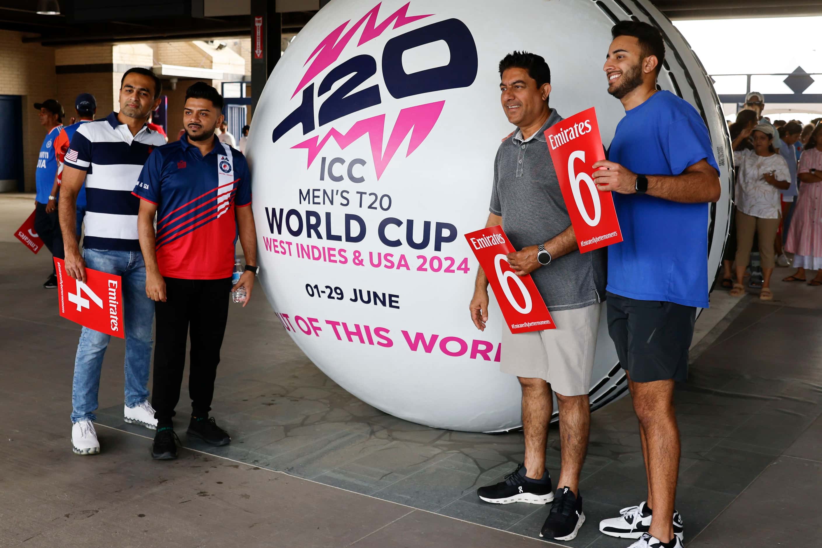 Crowd take photos in front of a giant cricket ball during the men's T20 World Cup cricket...