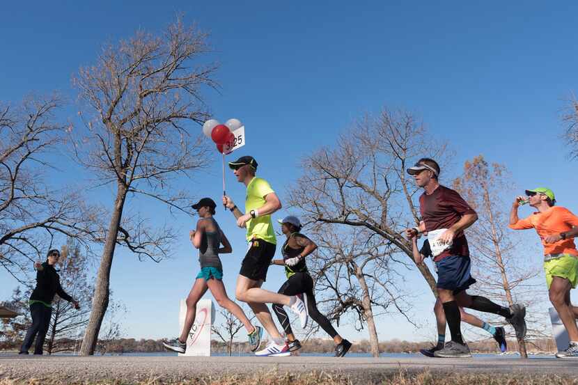 Runners approached the 15.5 mile mark along White Rock Lake during the BMW Dallas Marathon...