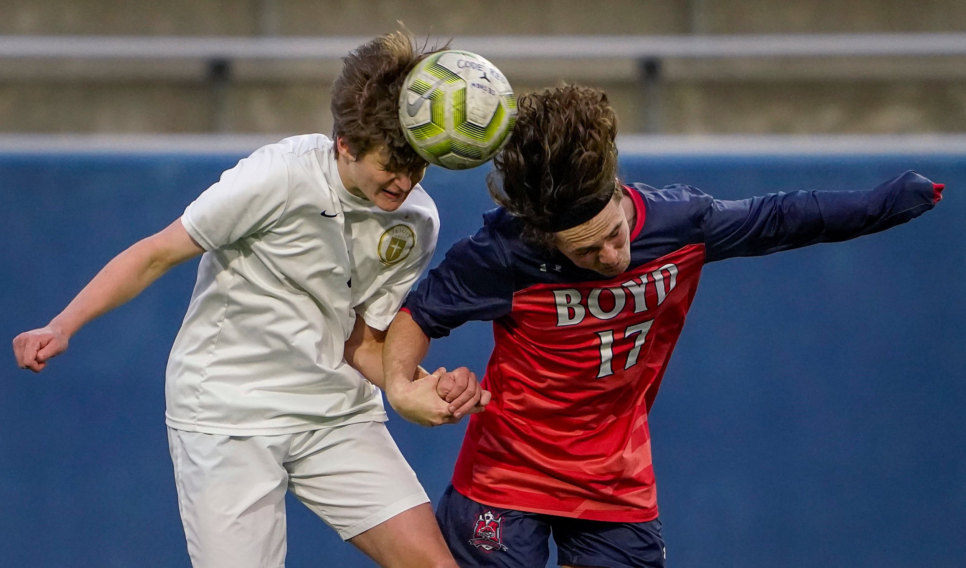 Jesuit midfielder Sullivan Scott (3) battles McKinney Boyd midfielder George Colandrea (17)...