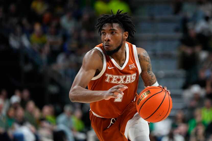 Texas's Tyrese Hunter drives to the basket against Baylor during the second half of an NCAA...