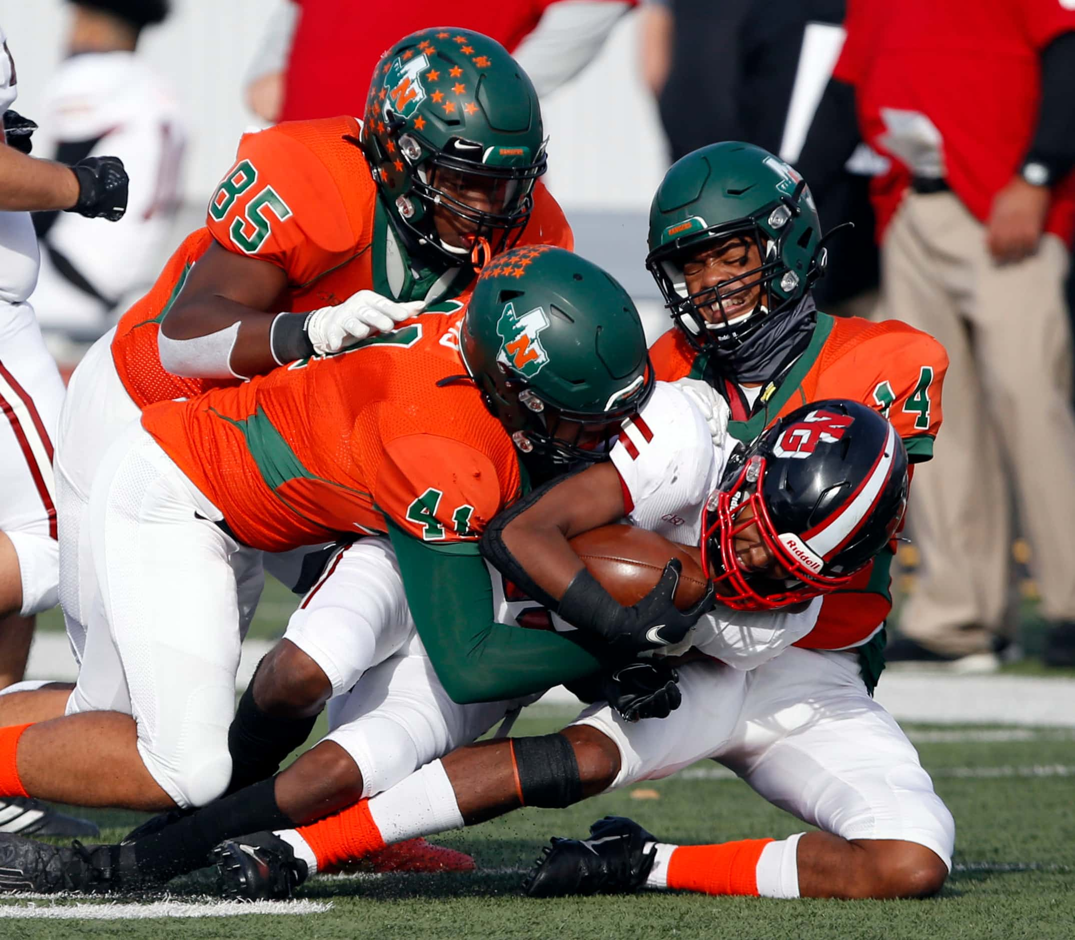 A group of Naaman Forest defenders, including Tommy Dunn (85), Chandler Davis (41) and...