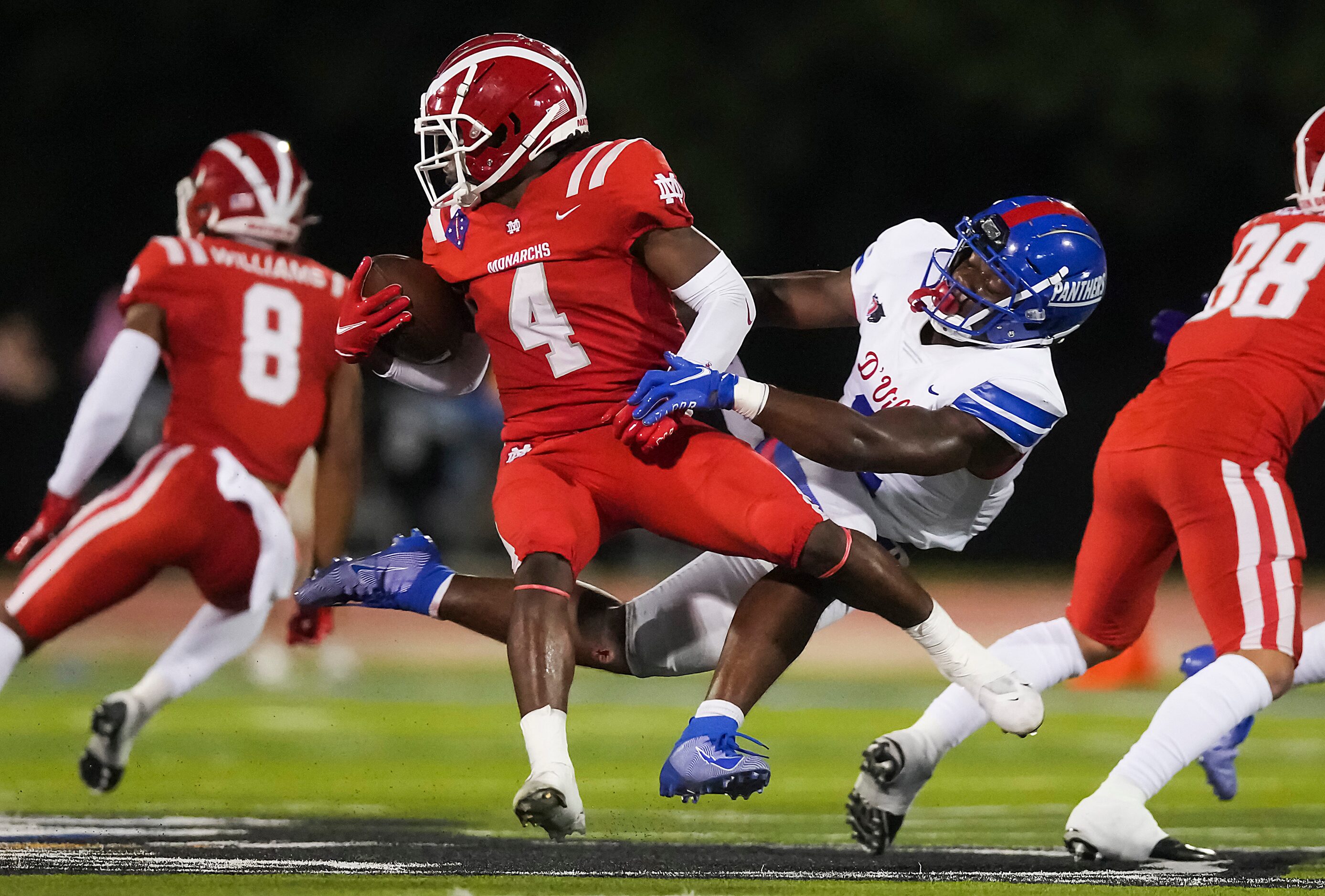 Mater Dei running back Raleek Brown (4) is brought down by Duncanville linebacker Jordan...