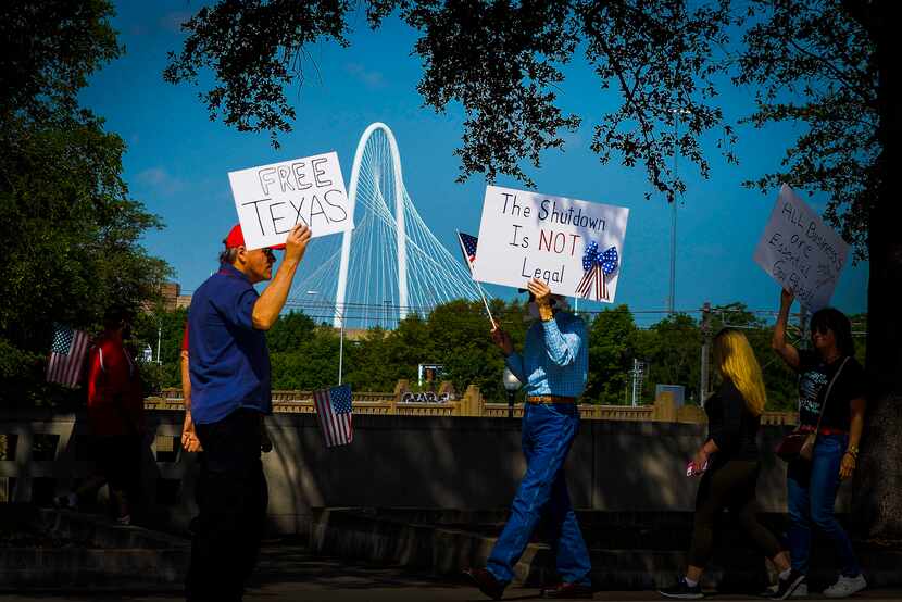 Protesters rallied against government stay-at-home orders at Dealey Plaza in Dallas on April...