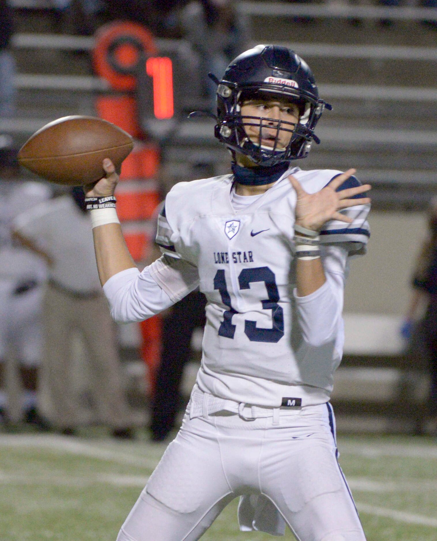 Lone Star quarterback Garret Rangel throws a pass in the first quarter of a high school...