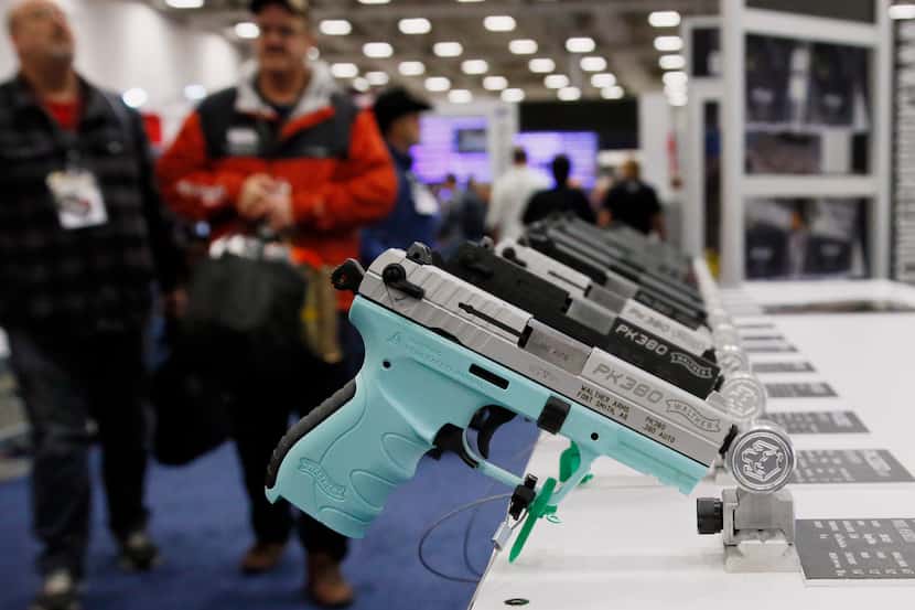 FILE - In this May 4, 2018, file photo, handguns are on display at the The National Rifle...