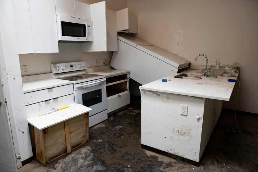 A kitchen is damaged by the torrential downpour that caused massive flooding in a Gibson...