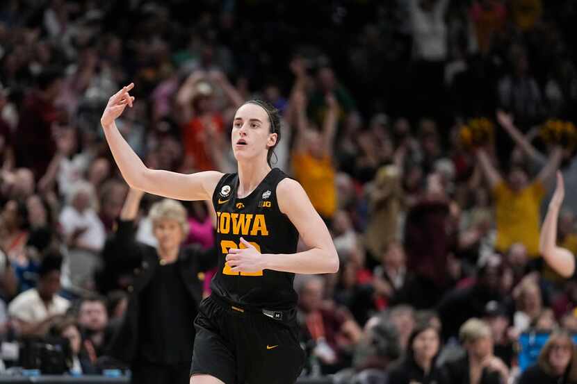 Iowa's Caitlin Clark reacts after a three pointer during the second half of an NCAA Women's...