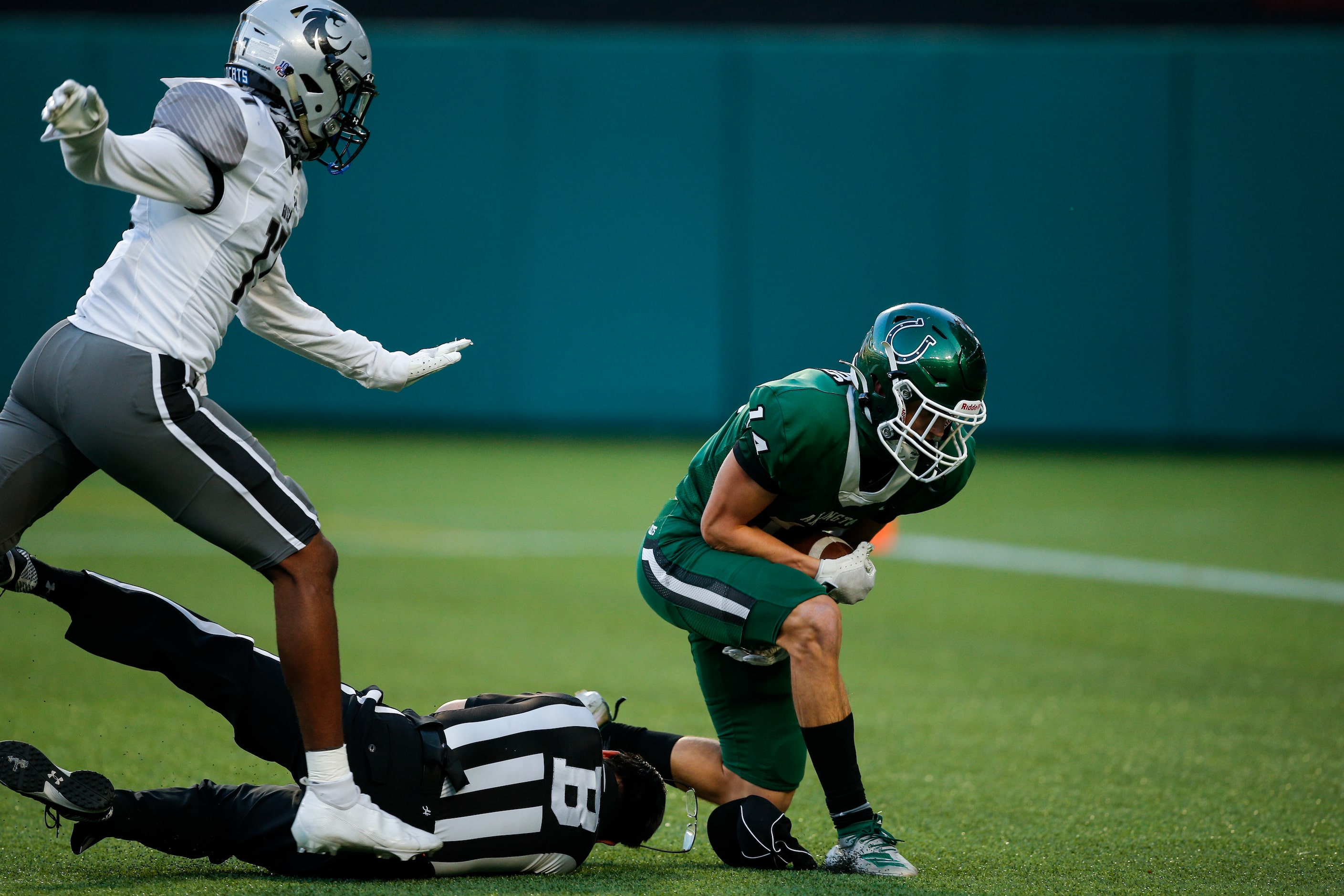 Denton Guyer senior safety Jaden Fuggett, left, defends as Arlington senior wide receiver...