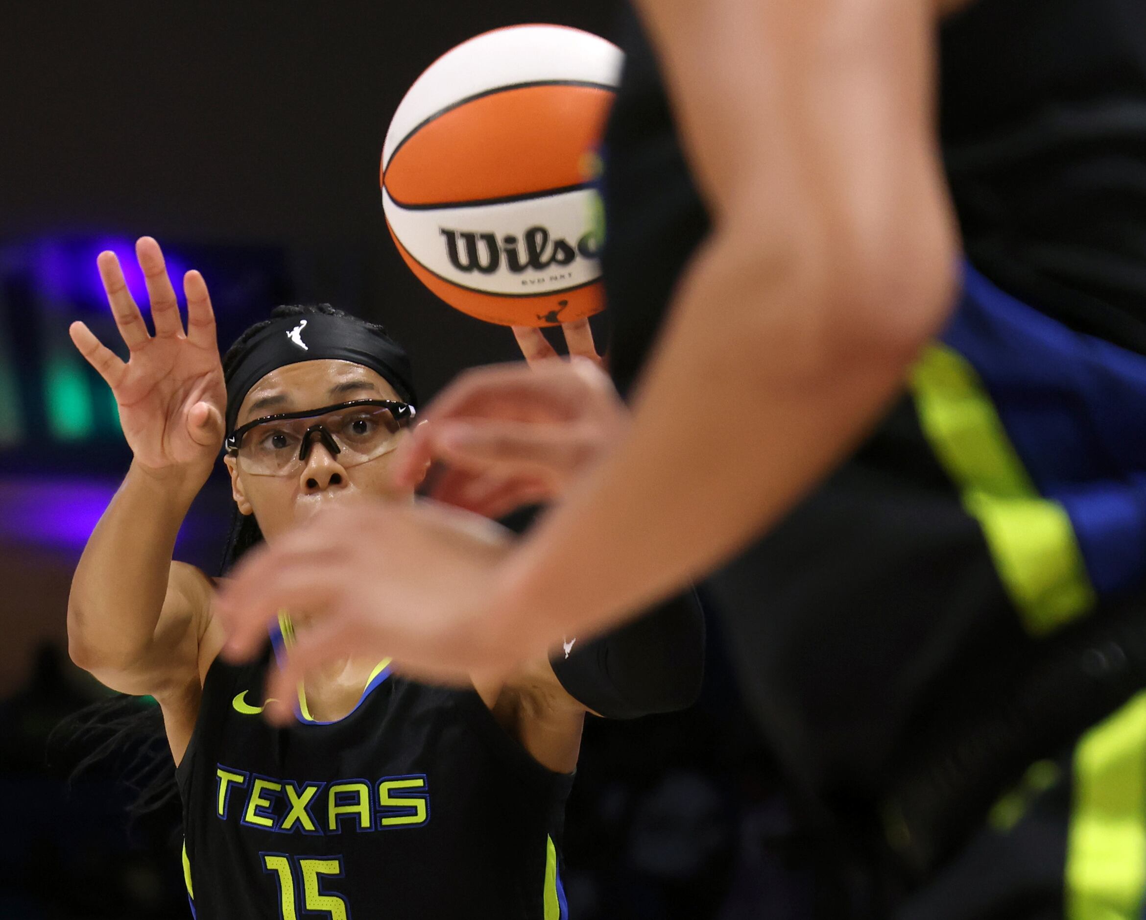 Dallas Wings guard Allisha Gray (15) passes to a teammate during the first half of play...