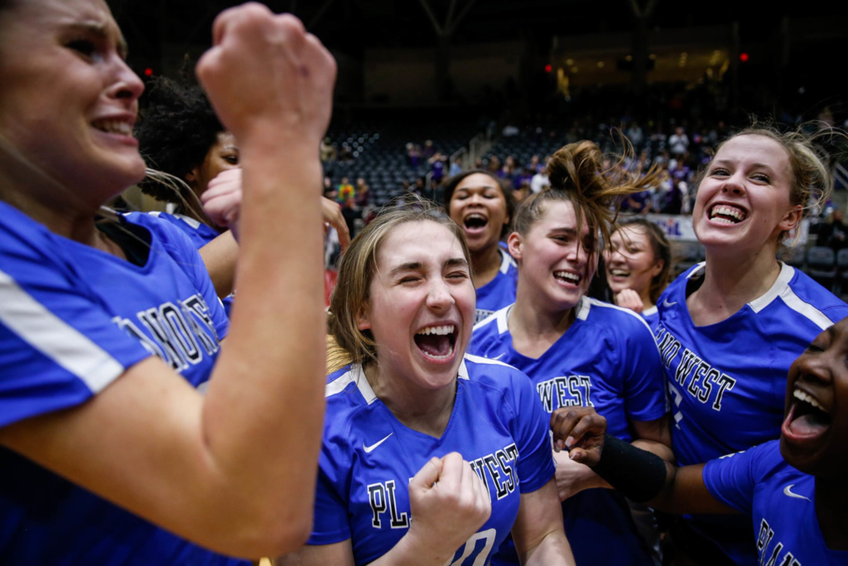 The Plano West Wolves celebrate after winning the fifth and final set during a class 6A...