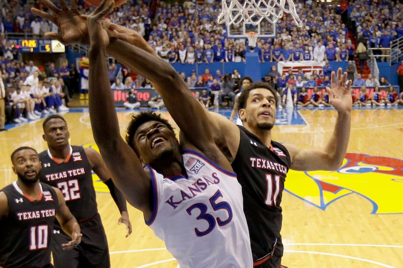 Kansas' Udoka Azubuike (35) is fouled by Texas Tech's Zach Smith (11) as he shoots during...