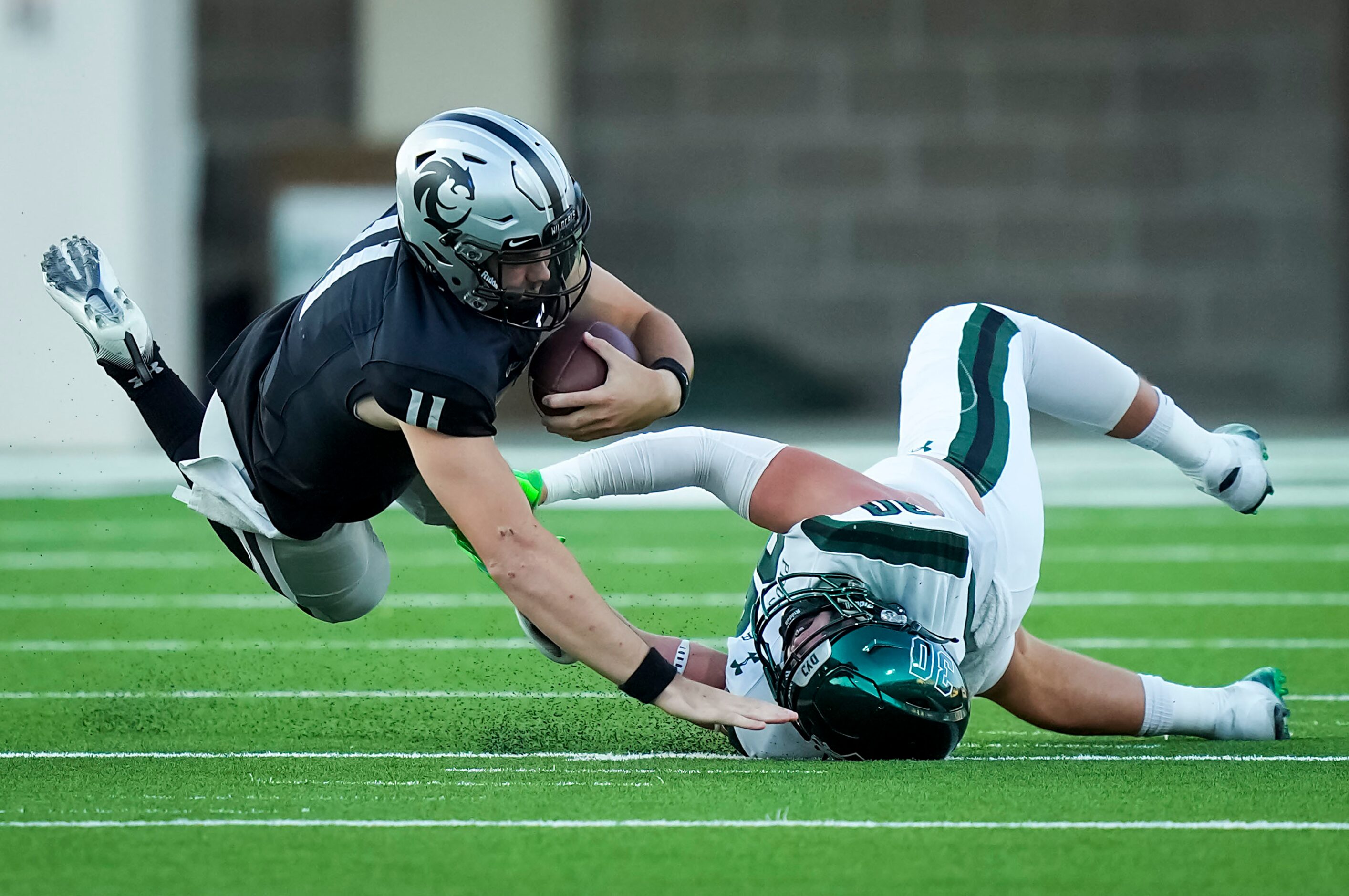 Denton Guyer quarterback Jackson Arnold (11) is dropped for a loss by Prosper linebacker...