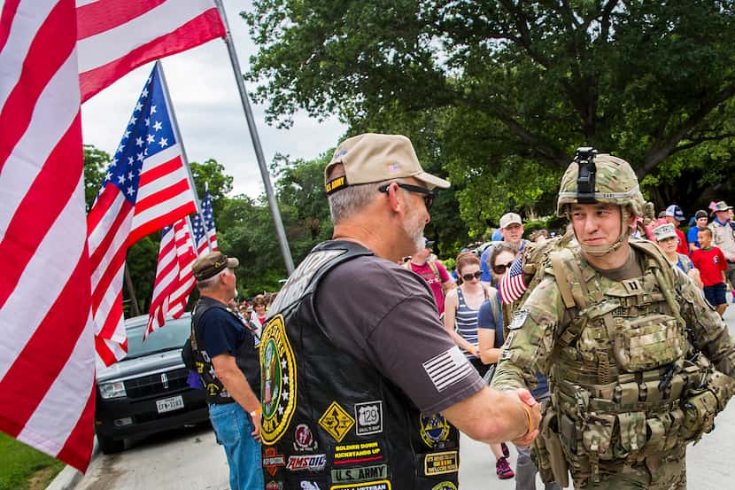 Iraq war veteran Glen Dare of McKinney (right) thanks members of the Patriot Riders who...