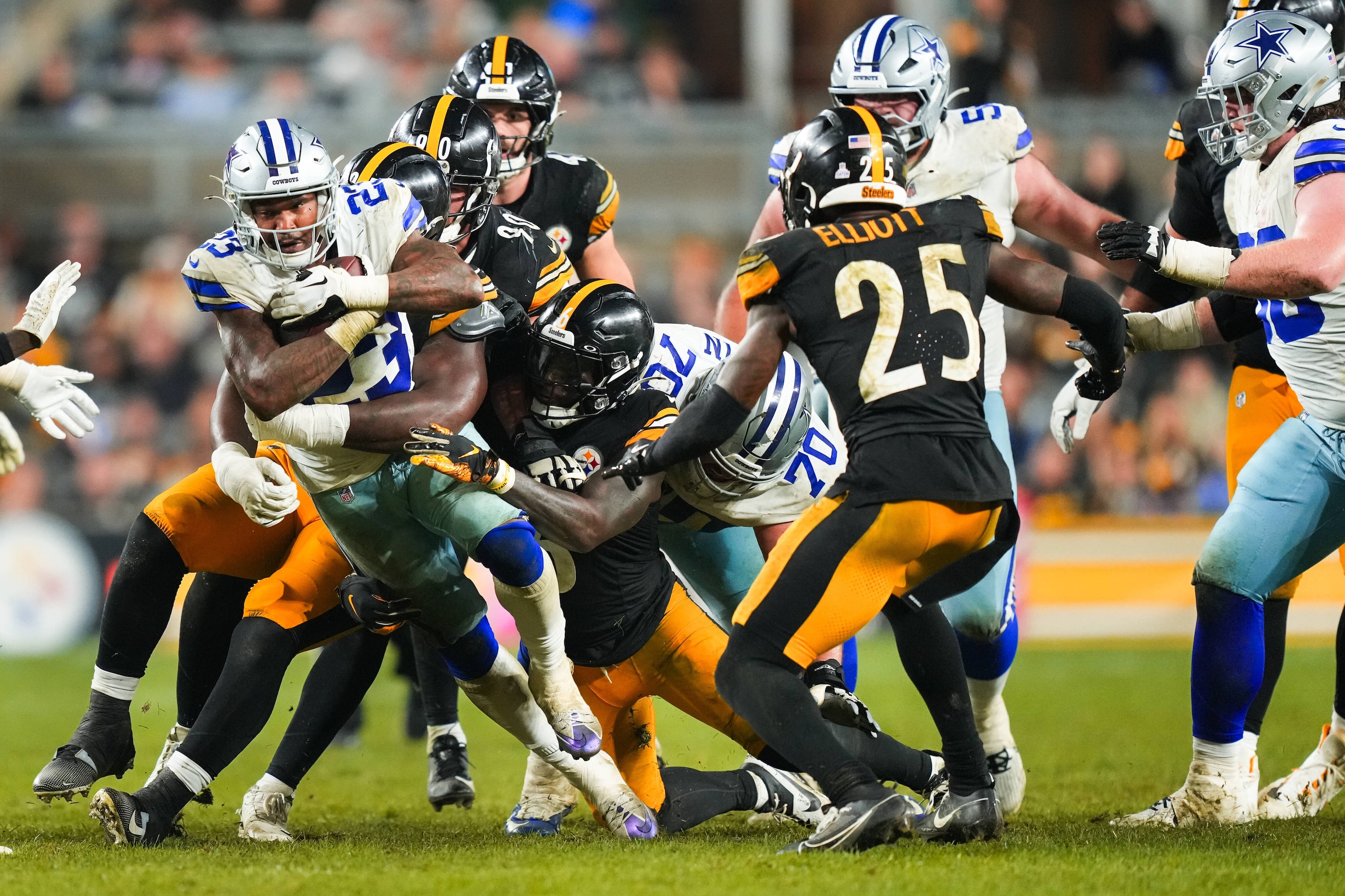 Dallas Cowboys running back Rico Dowdle (23) pushes through the Pittsburgh Steelers defense...