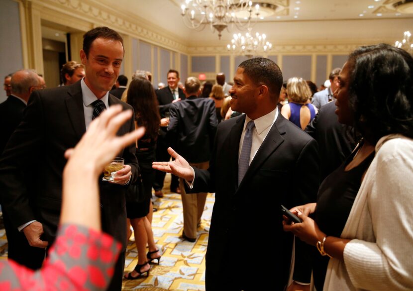 James and Frances Waters greet others before the start of the 33rd annual H. Neil Mallon...