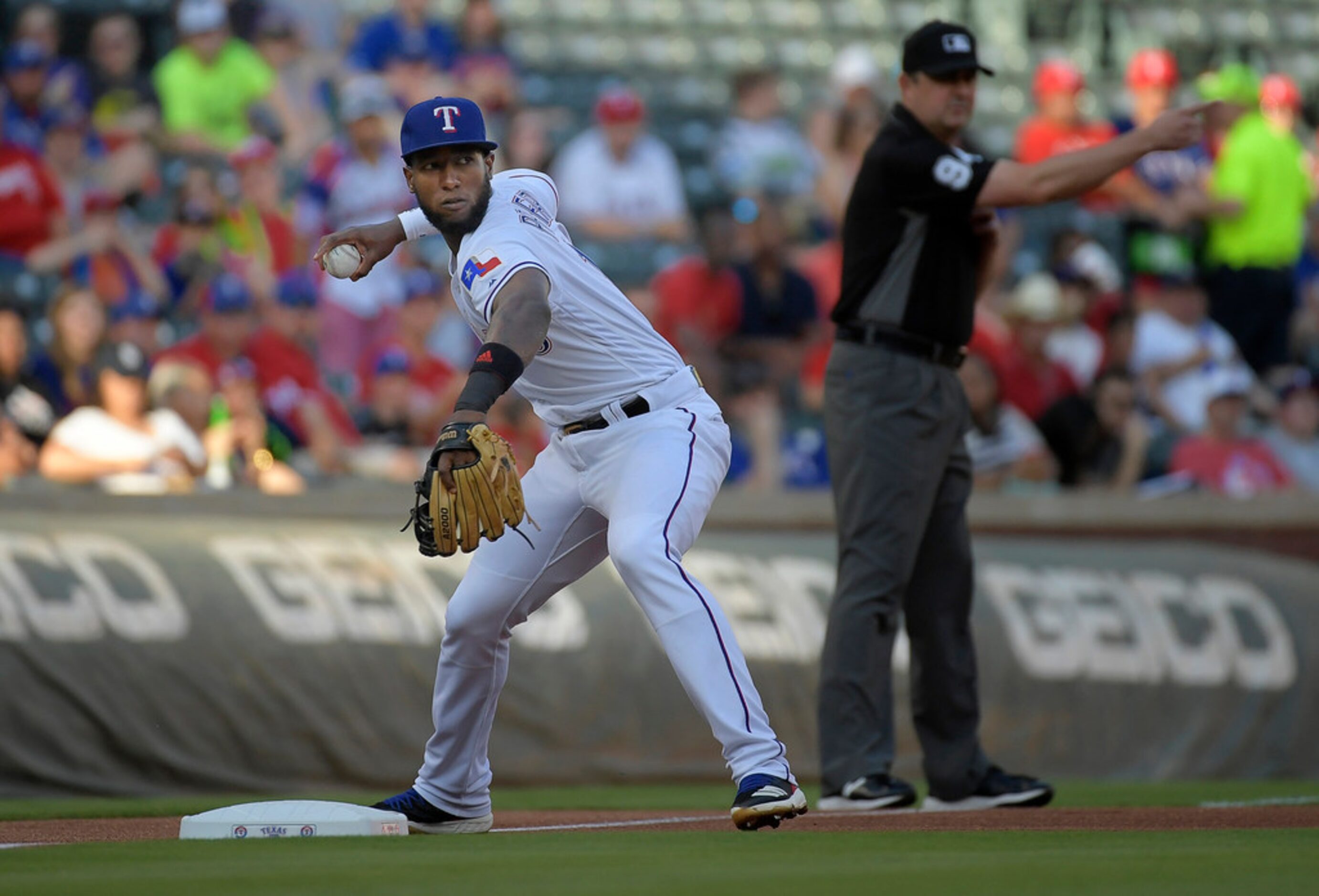 Texas Rangers third baseman Jurickson Profar (19) throws out San Diego Padres center fielder...