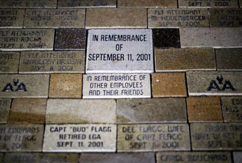 Names of flight crew members killed during the 9/11 attacks are etched into bricks on the...