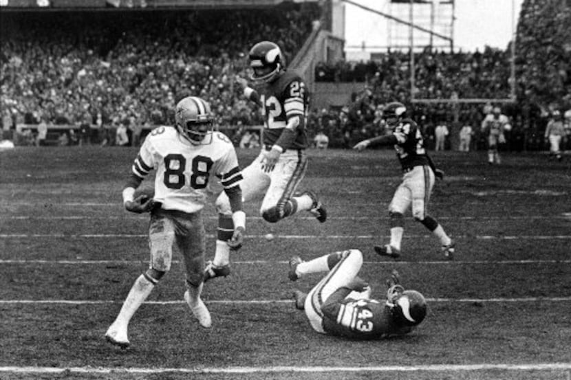 Dallas Cowboys receiver Drew Pearson (88) catches Roger Staubach's "Hail Mary Pass" during...