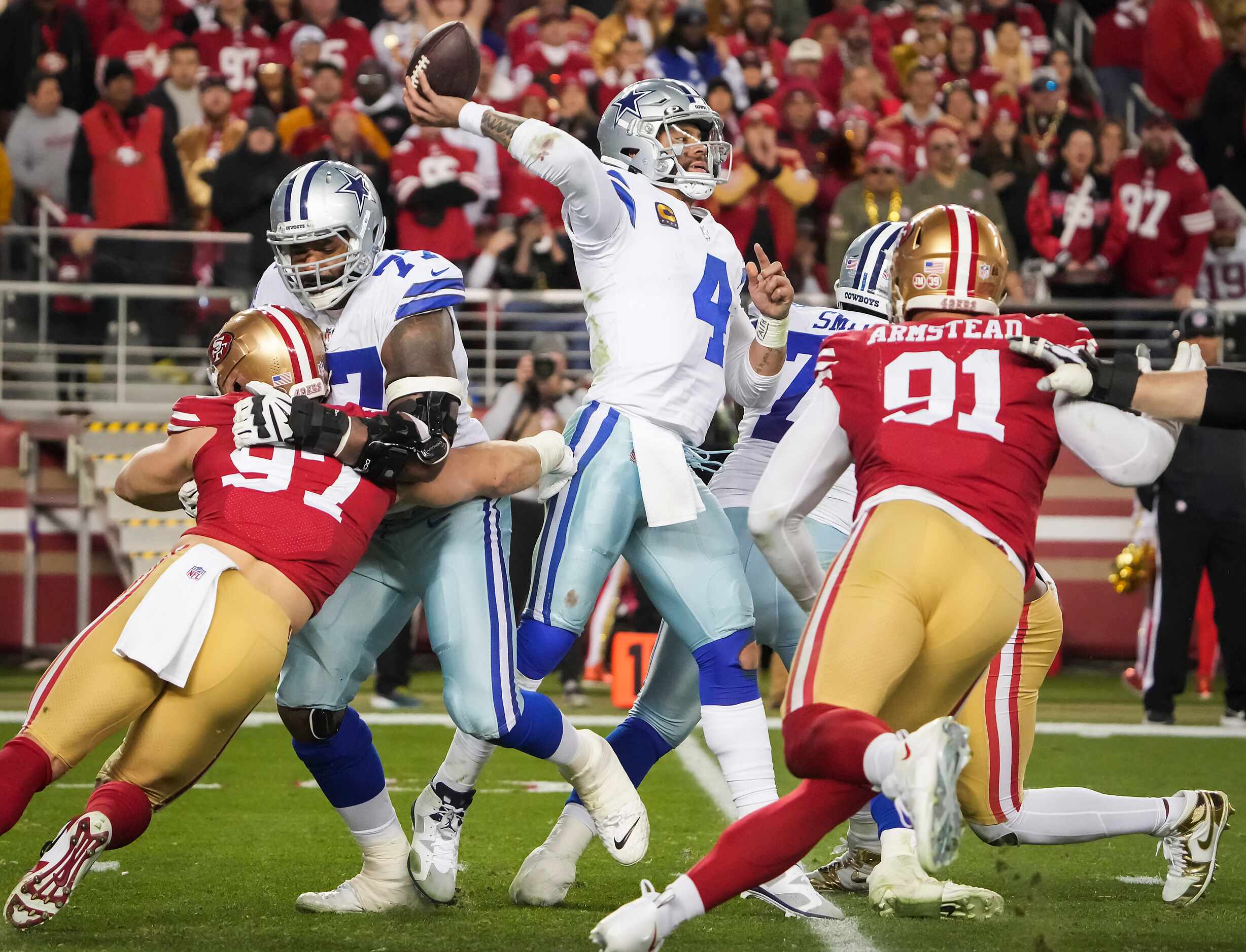 Dallas Cowboys quarterback Dak Prescott (4) throws a pass under pressure fro San Francisco...
