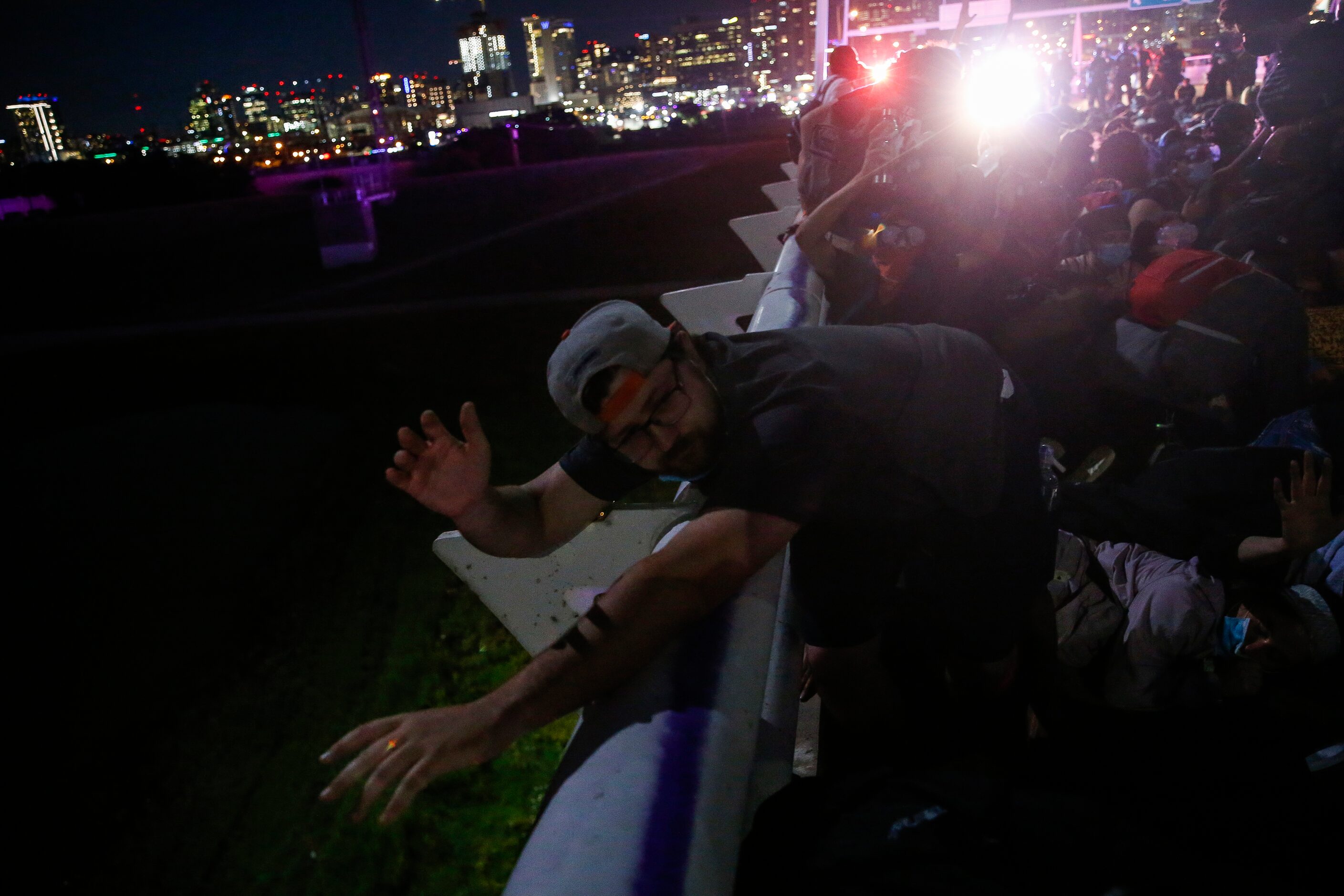 Police surround and detain hundreds of protesters who marched onto the Margaret Hunt Hill...