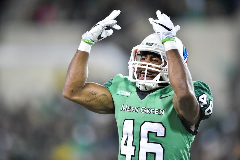 The Mean Green football team pumps up the crowd before they kickoff to opponent, Army, at...