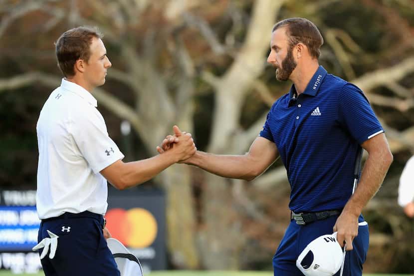 WESTBURY, NY - AUGUST 27:  Jordan Spieth and Dustin Johnson of the United States shake hands...