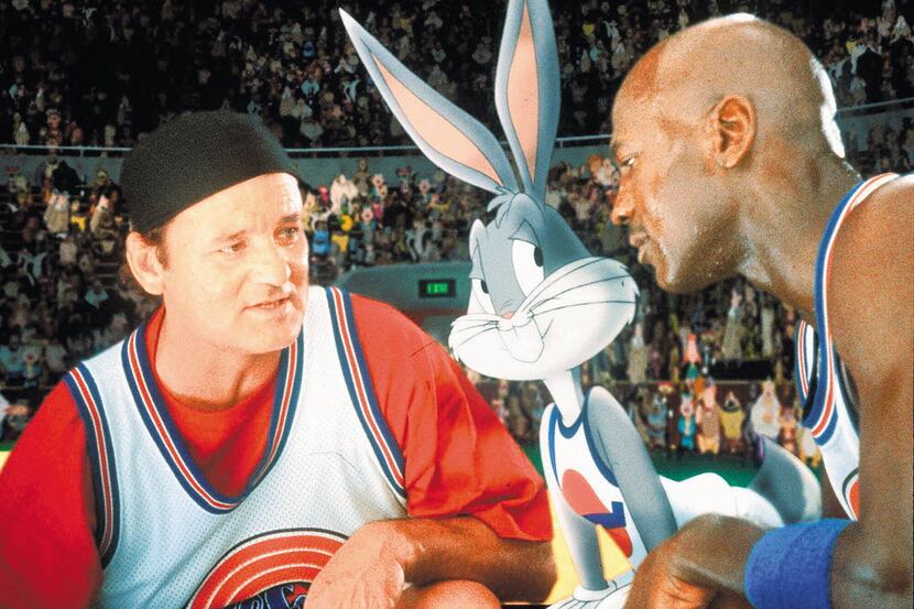 Bill Murray, left, Bugs Bunny, and Michael Jordan are shown in a scene from the Warner Bros....