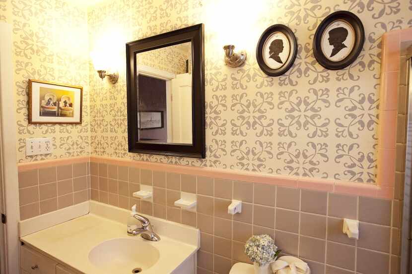 Lilly Neubauer used the original pink tilling in the bathroom as a jumping-off point. She...