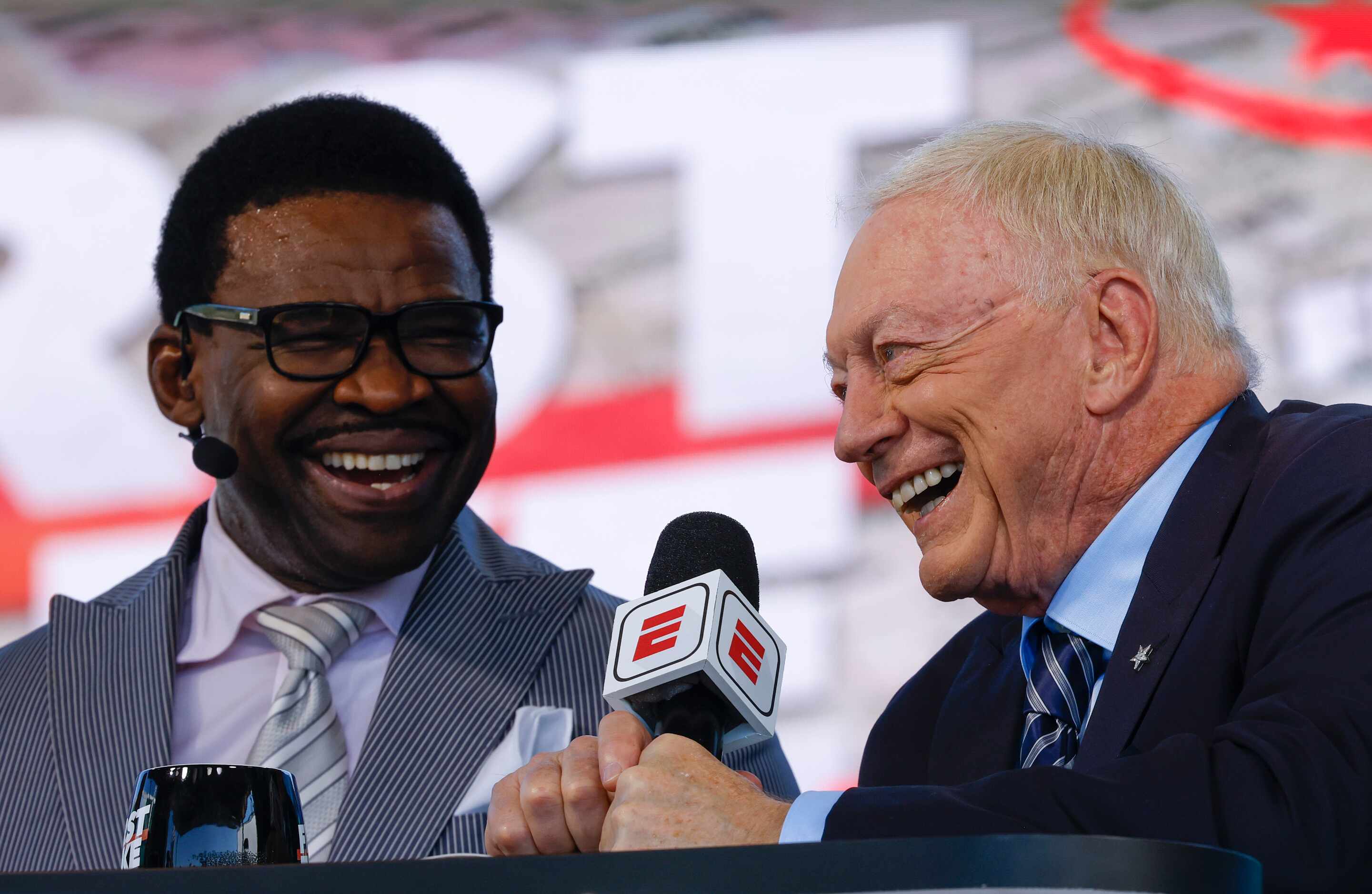 Former Dallas Cowboys player Michael Irvin, left, and Cowboys owner Jerry Jones laughs...