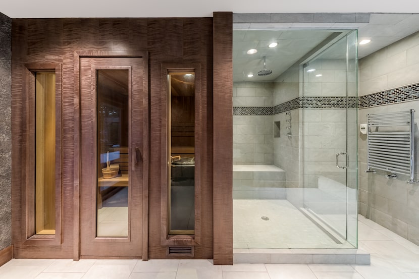 This custom sauna sits alongside a luxe shower in a Dallas home.