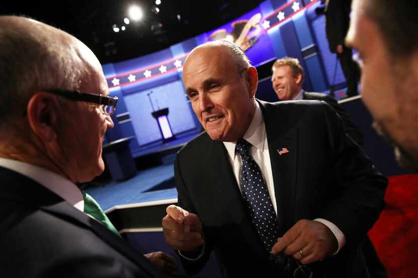 Former New York City mayor Rudy Giuliani speaks with guests before the start of the third...