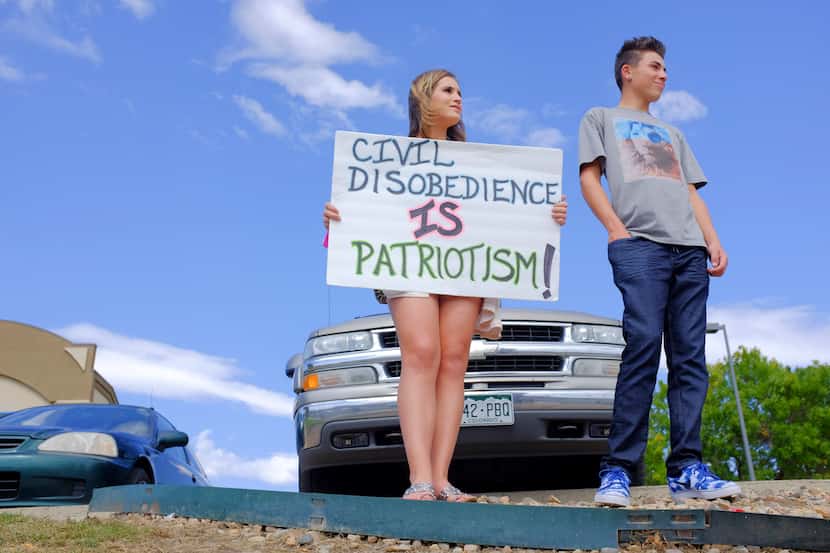 Ella Gonzales and Jordan Miller, high school students, take part in a walkout protest...