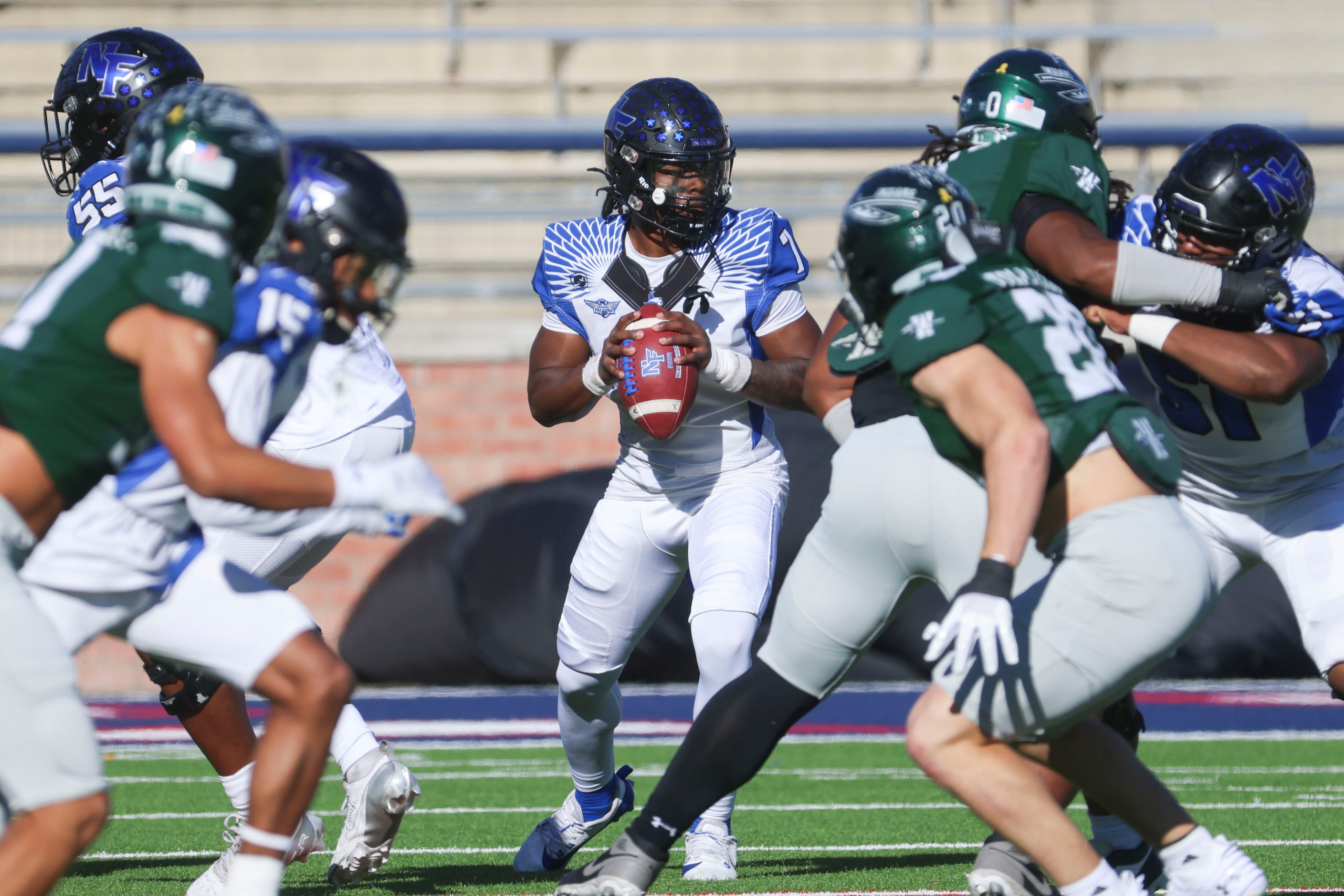 North Forney High’s QB Legend Bey looks to throw the ball against Waxahachie High during the...