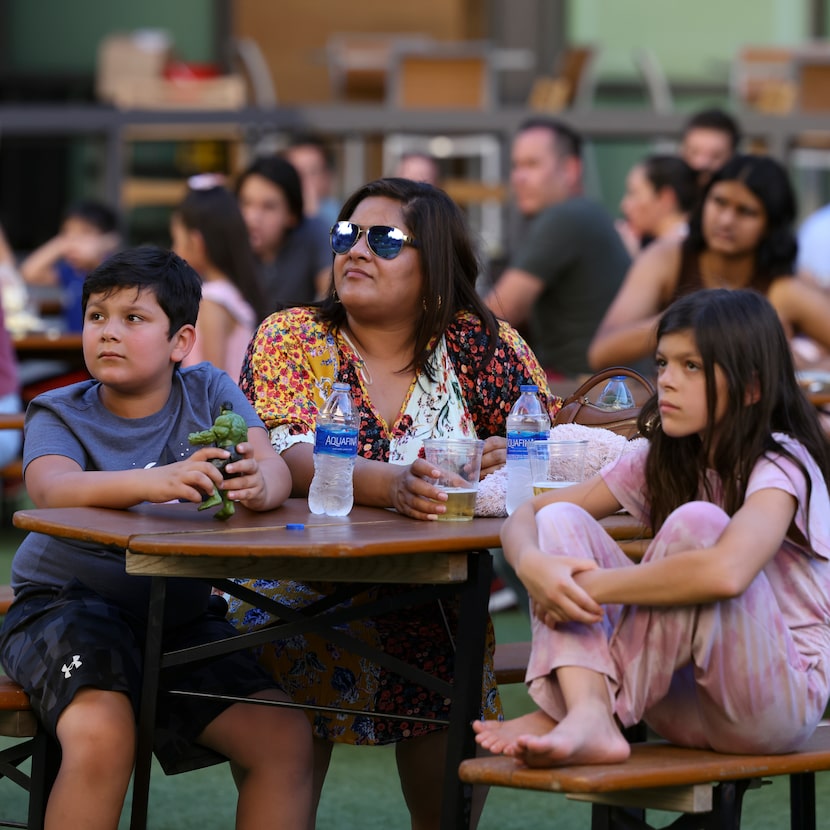 Jay Bowdery, 7, his mother, Anoop, and sister, Tara, 8, watch "Spider-Man: No Way Home" at...