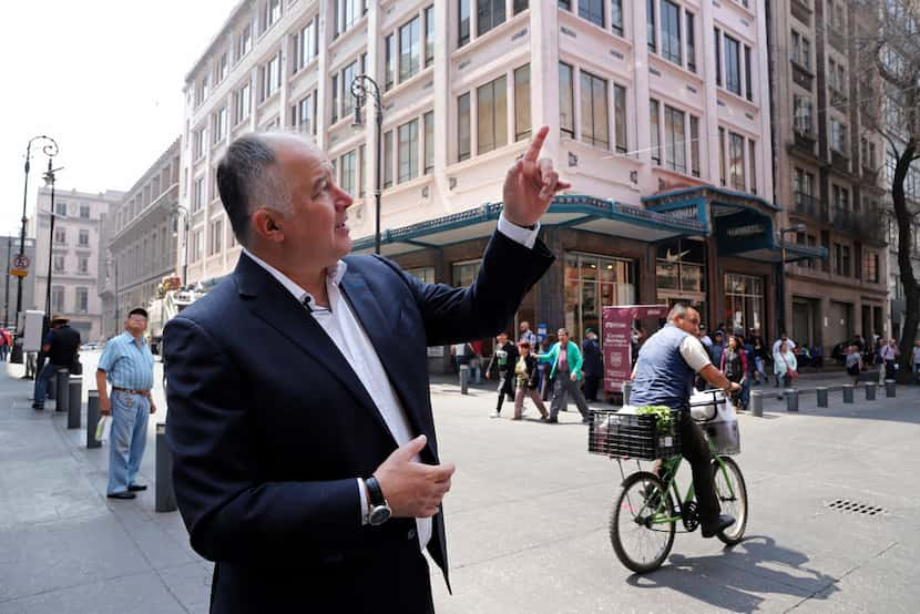 Hector de Mauleon points to a street sign along Motolinia Street, which used to be known as...