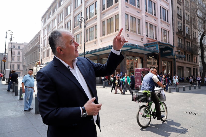 Hector de Mauleon points to a street sign along Motolinia Street, which used to be known as...